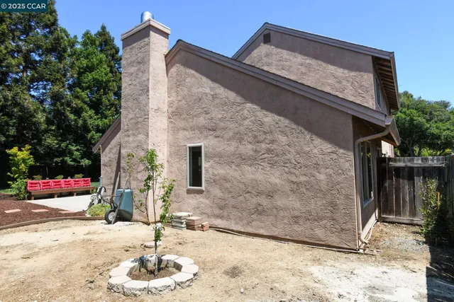 a view of a backyard with sitting area
