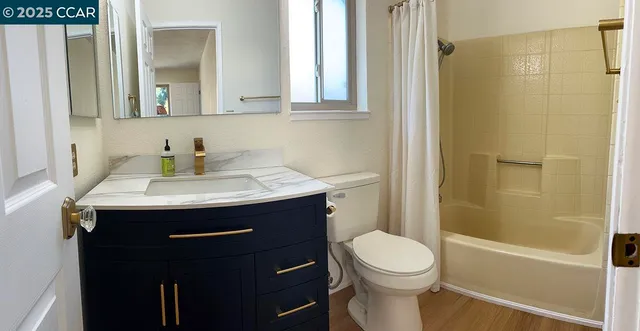 a kitchen with granite countertop a stove and cabinets