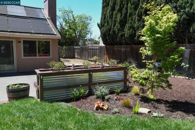 a wooden bench sitting in front of a house