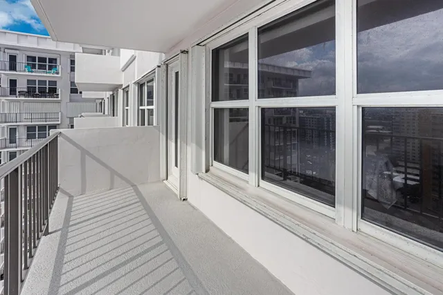 a view of a balcony with door