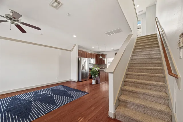a view of entryway and hall with wooden floor
