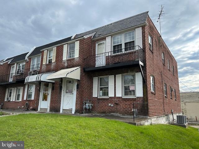 a view of a yard in front of a brick house