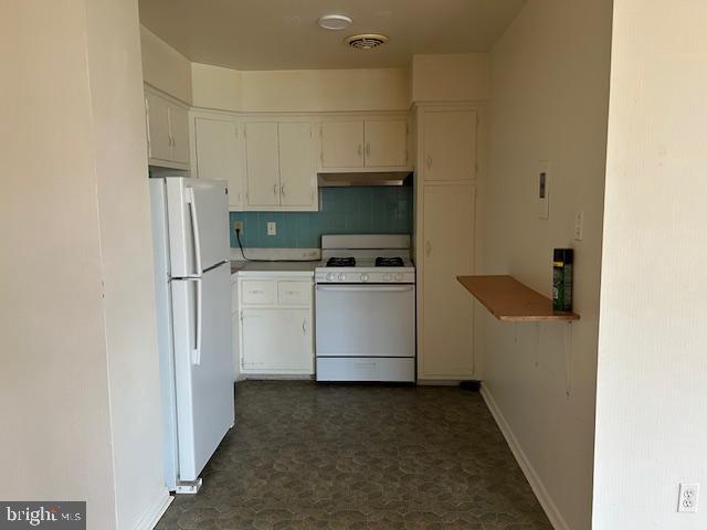 386 Beverly Boulevard, Unit B Upper Darby, PA 19082 - Photo 3 of 7 a utility room with cabinets washer and dryer