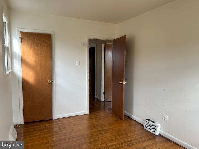 386 Beverly Boulevard, Unit B Upper Darby, PA 19082 - Photo 7 of 7 a view of an empty room with wooden floor and a bathroom