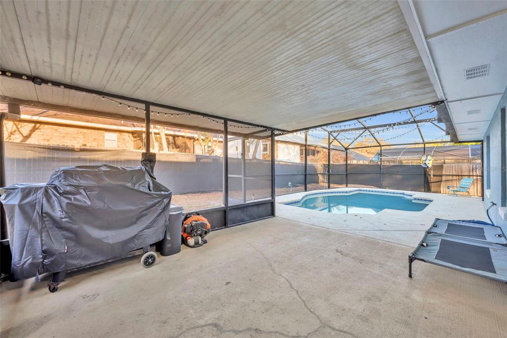 202 Bryan Street Eustis, FL 32726 - Photo 25 of 53 a view of a livingroom with furniture and floor to ceiling window