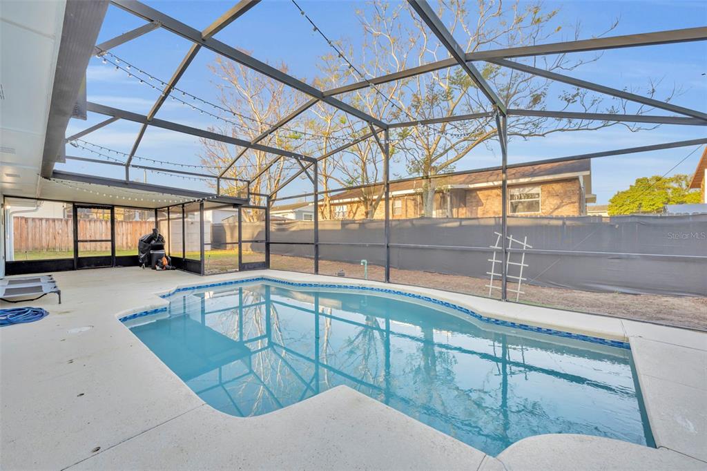 202 Bryan Street Eustis, FL 32726 - Photo 28 of 53 a kitchen with stainless steel appliances kitchen island granite countertop a sink and cabinets