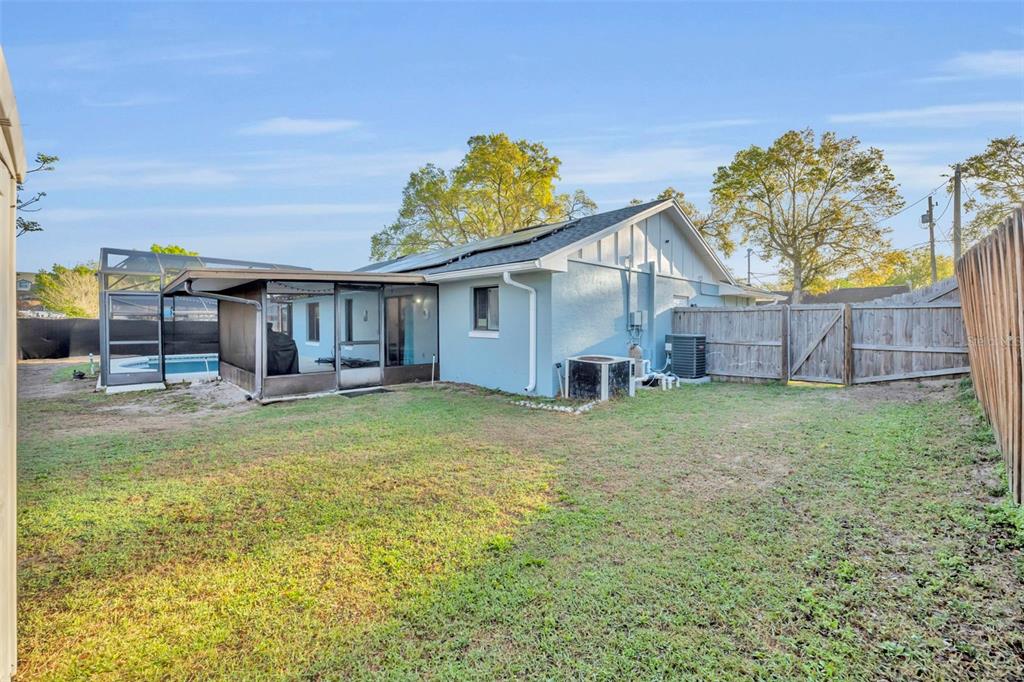 202 Bryan Street Eustis, FL 32726 - Photo 31 of 53 a view of a house with a backyard and a patio