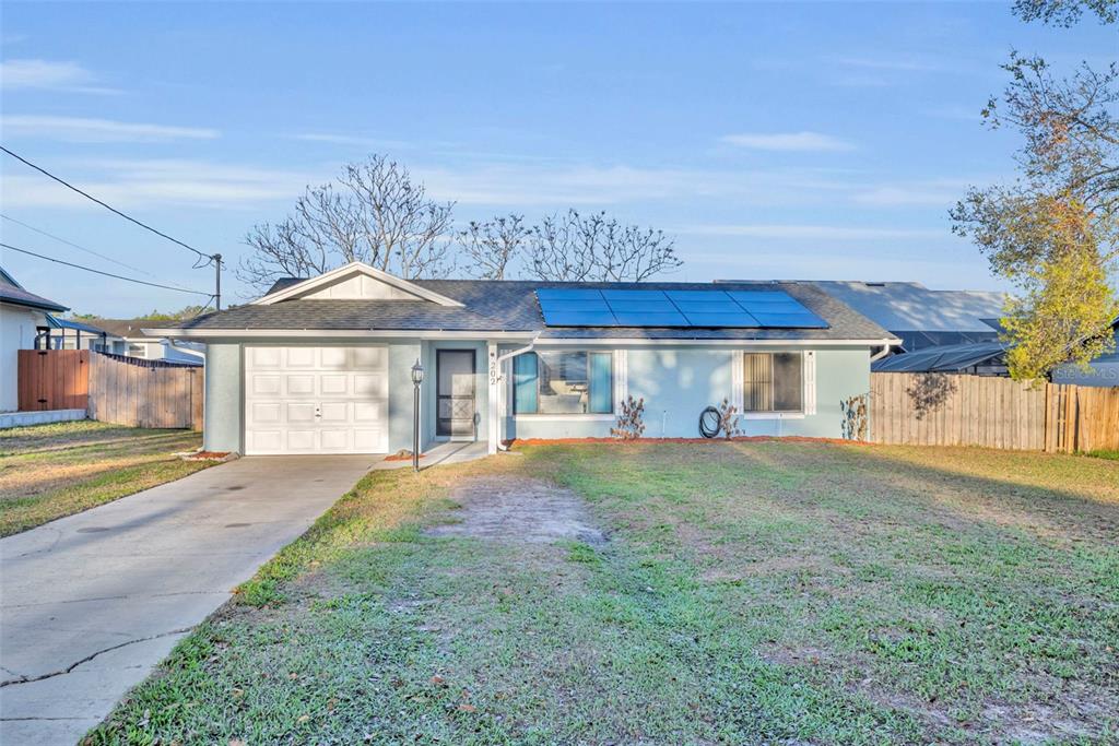 202 Bryan Street Eustis, FL 32726 - Photo 50 of 53 a view of a house with a yard and pathway