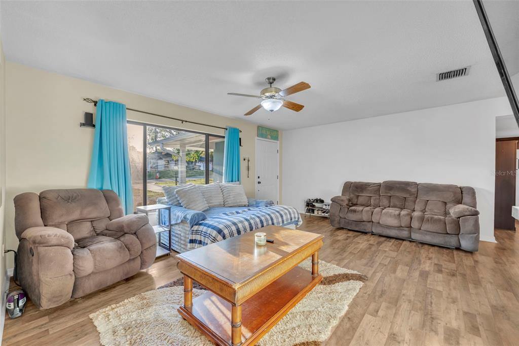202 Bryan Street Eustis, FL 32726 - Photo 7 of 53 a living room with furniture and a large window