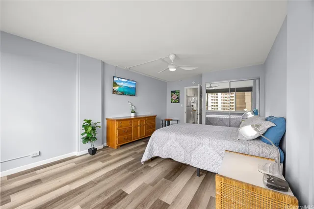 a bedroom with a bed and window