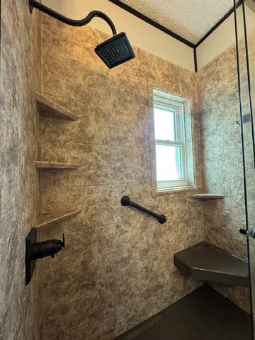 a bathroom with a sink and a shower