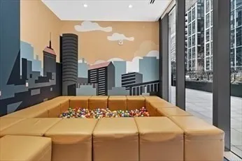 a bed sitting in a bedroom next to a large window