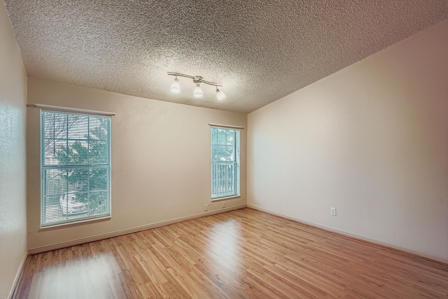 3100 Jeanetta Street, Unit 602 Houston, TX 77063 - Photo 26 of 34 an empty room with wooden floor cabinet and windows