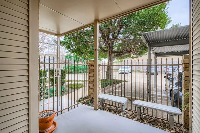 a view of balcony with furniture