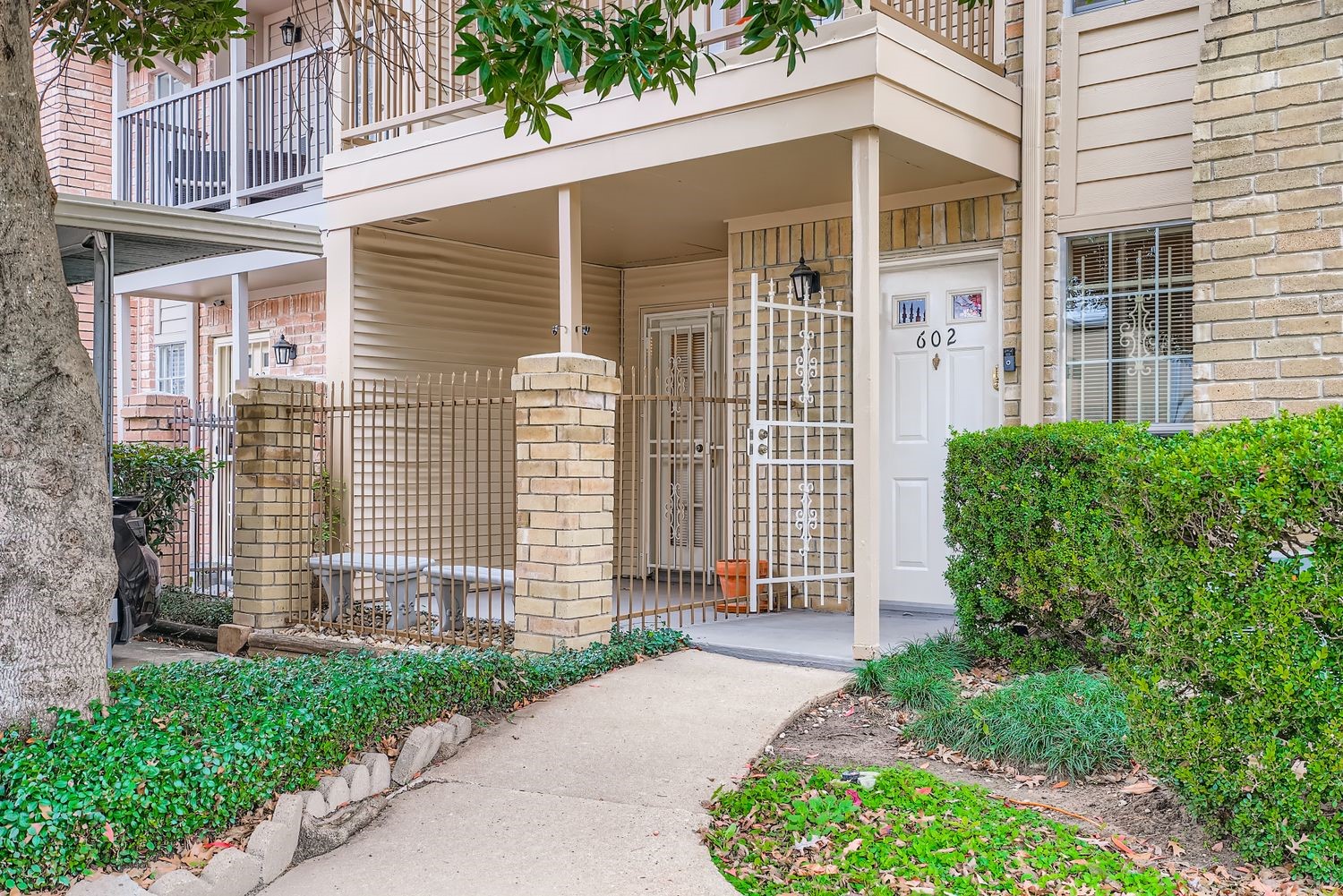 3100 Jeanetta Street, Unit 602 Houston, TX 77063 - Photo 3 of 34 a front view of a house with a garden