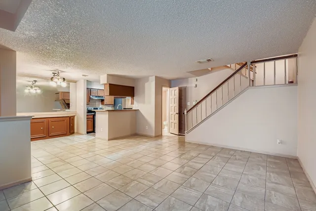 a view of a kitchen with a sink cabinets and a living room