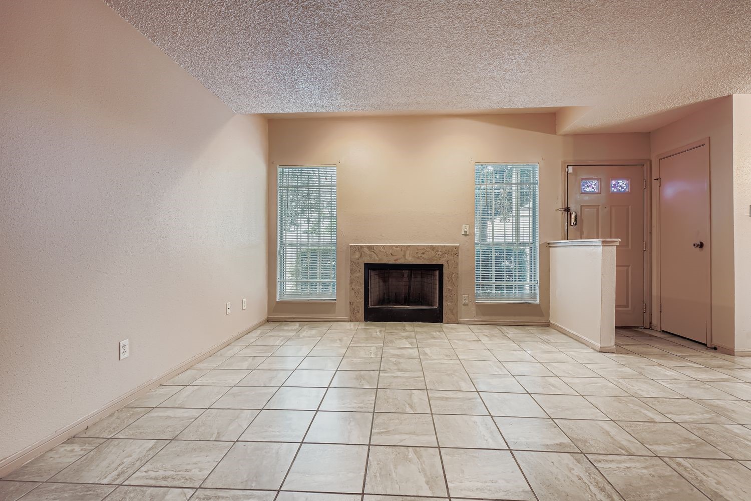 3100 Jeanetta Street, Unit 602 Houston, TX 77063 - Photo 8 of 34 an empty room with windows and fireplace