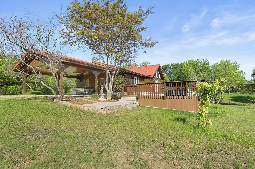 821 Ewing Road Ferris, TX 75125 - Photo 21 of 40 a view of a house with a yard porch and sitting area