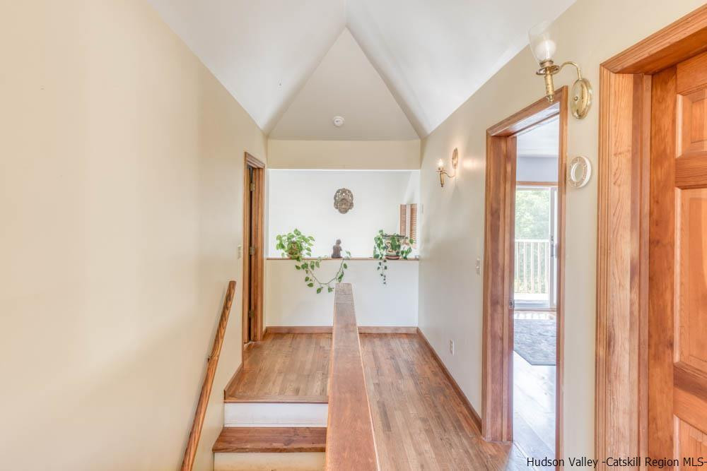 686 Berme Road High Falls, NY 12440 - Photo 12 of 23 a view of a hallway with wooden floor and glass door