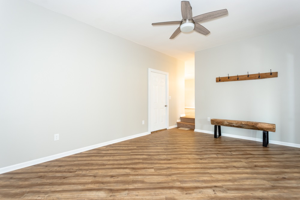 1469 Middle River Road Staunton, VA 24401 - Photo 18 of 50 a view of empty room with wooden floor and fan