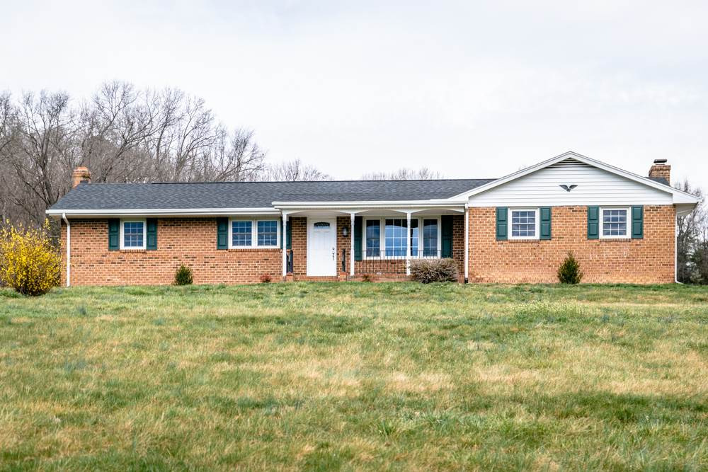 1469 Middle River Road Staunton, VA 24401 - Photo 2 of 50 a front view of a house with a garden
