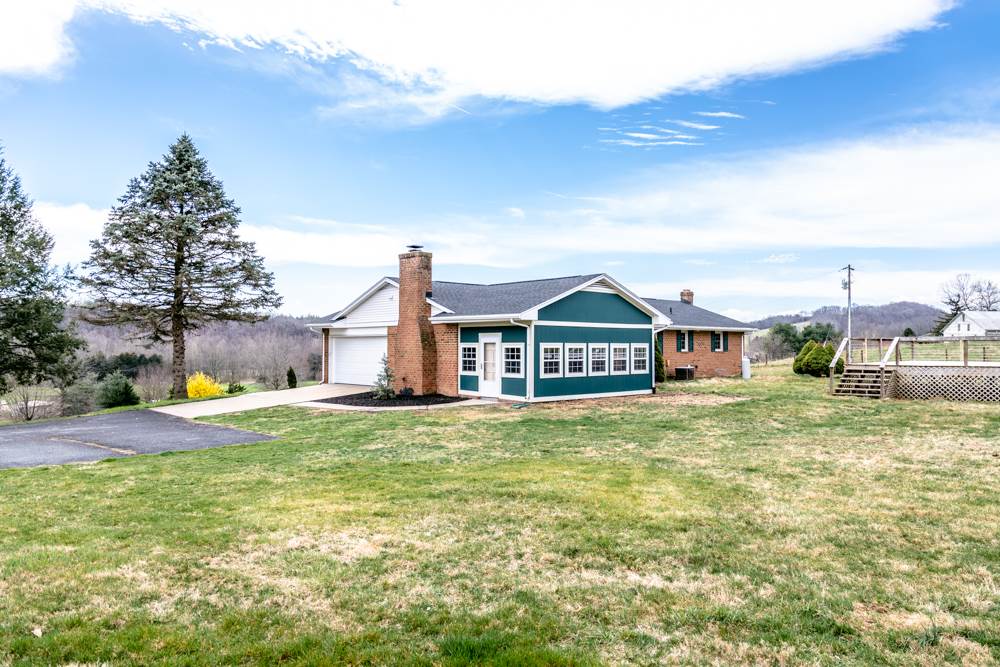 1469 Middle River Road Staunton, VA 24401 - Photo 46 of 50 a view of a big house with a big yard and large trees