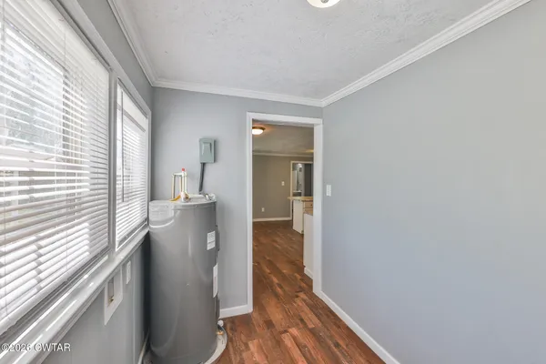 a view of hallway with wooden floor