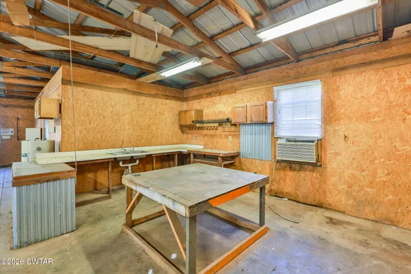 a view of a kitchen with furniture and a kitchen
