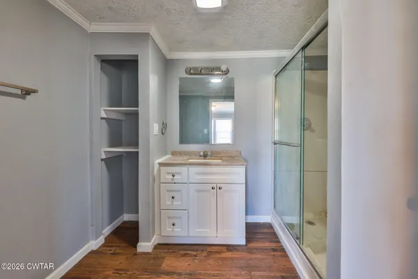 a bathroom with a vanity and a mirror