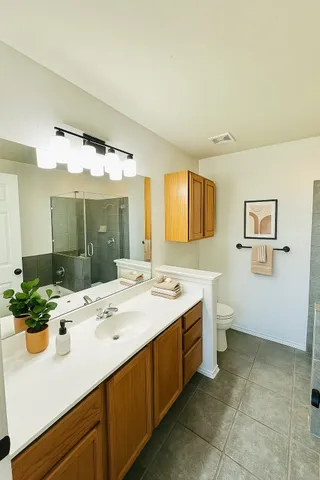 a bathroom with a sink and mirror