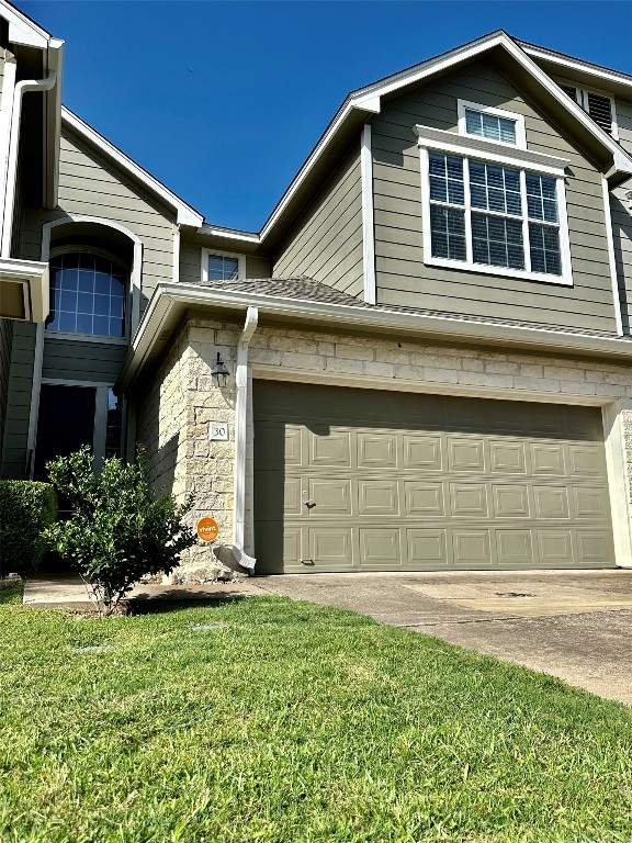 2632 Century Park Boulevard, Unit 30 Austin, TX 78727 - Photo 6 of 9 a front view of a house with a yard