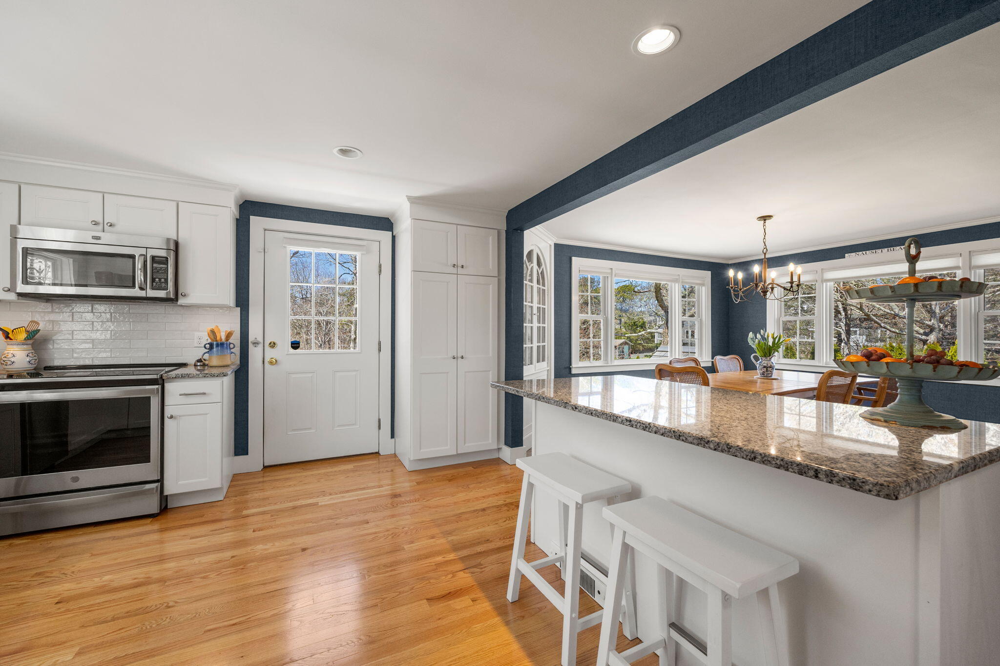 58 Stepping Stones Road Chatham, MA 02633 - Photo 7 of 52 a large kitchen with granite countertop a large window and stainless steel appliances