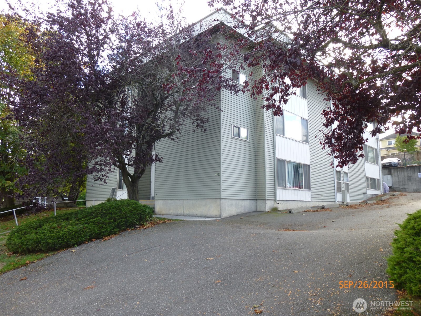 3326 Lombard Avenue, Unit 3 Everett, WA 98201 - Photo 1 of 10 a view of a house with a tree in the background