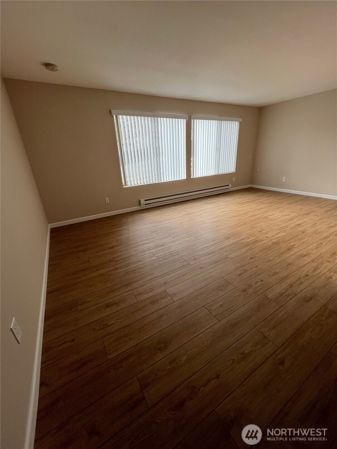3326 Lombard Avenue, Unit 3 Everett, WA 98201 - Photo 6 of 10 wooden floor in an empty room with a window