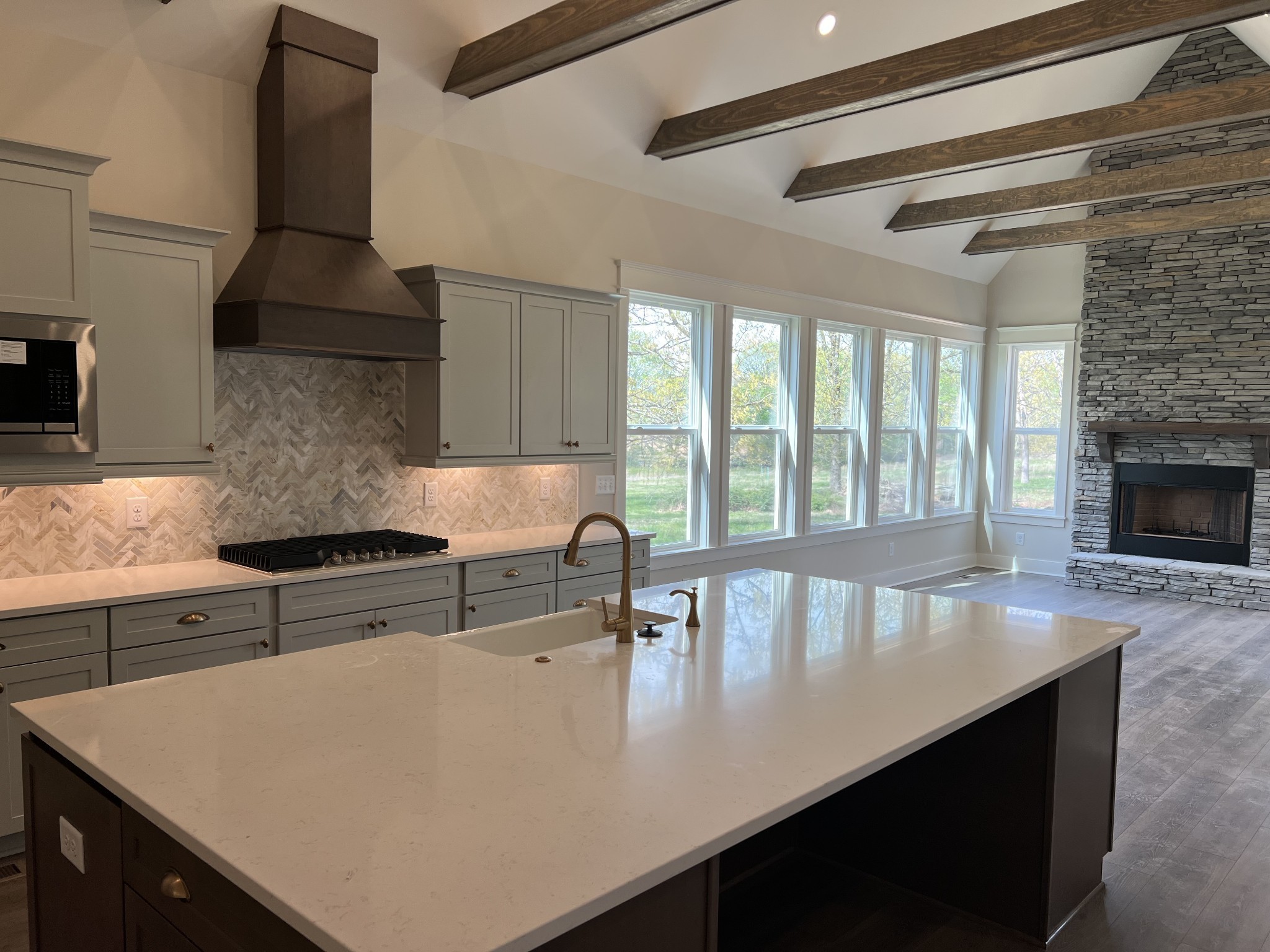7285 Northwest Highway Fairview, TN 37062 - Photo 11 of 22 a kitchen with stainless steel appliances a stove refrigerator and cabinets