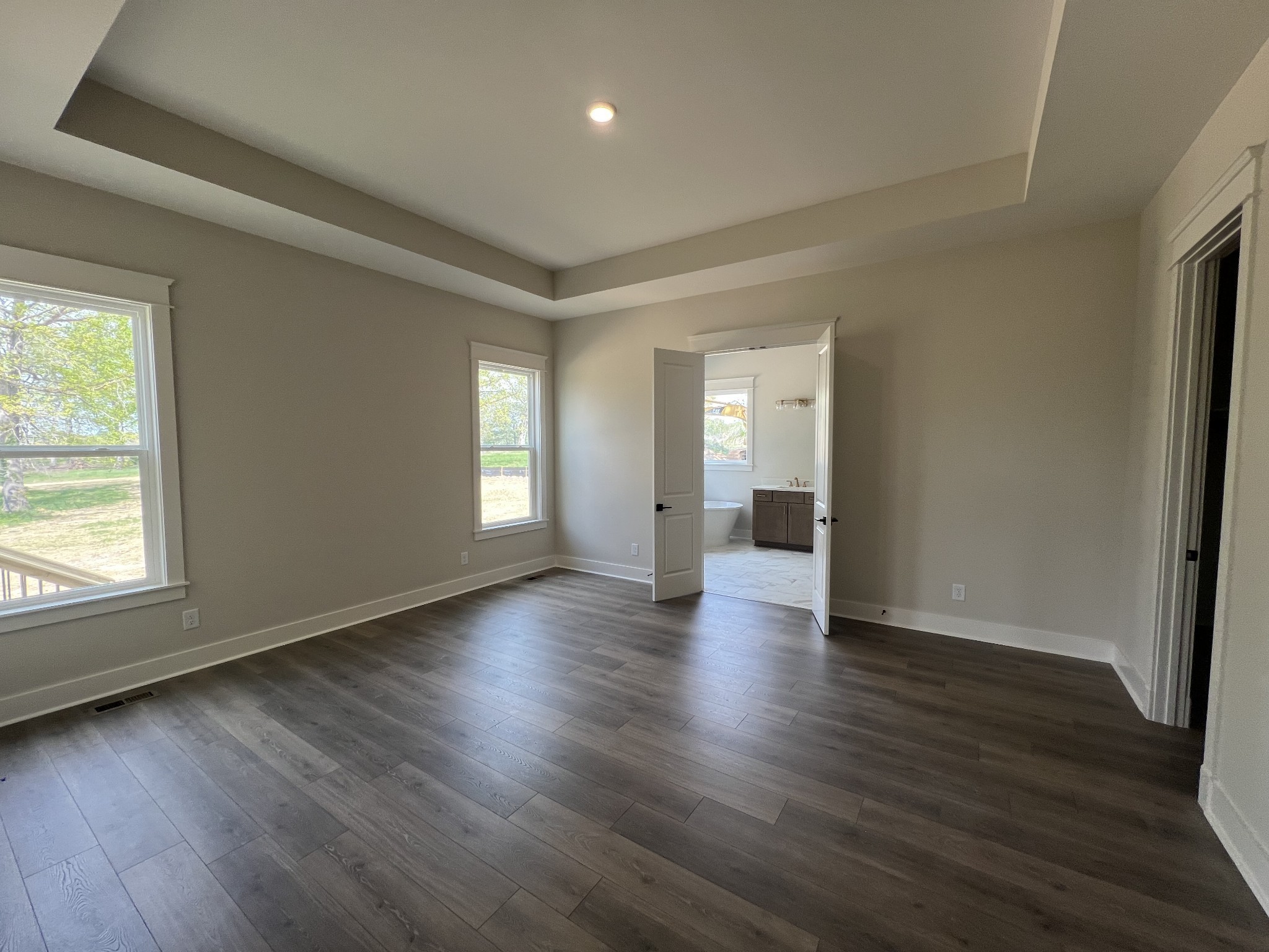 7285 Northwest Highway Fairview, TN 37062 - Photo 15 of 22 an empty room with wooden floor and windows