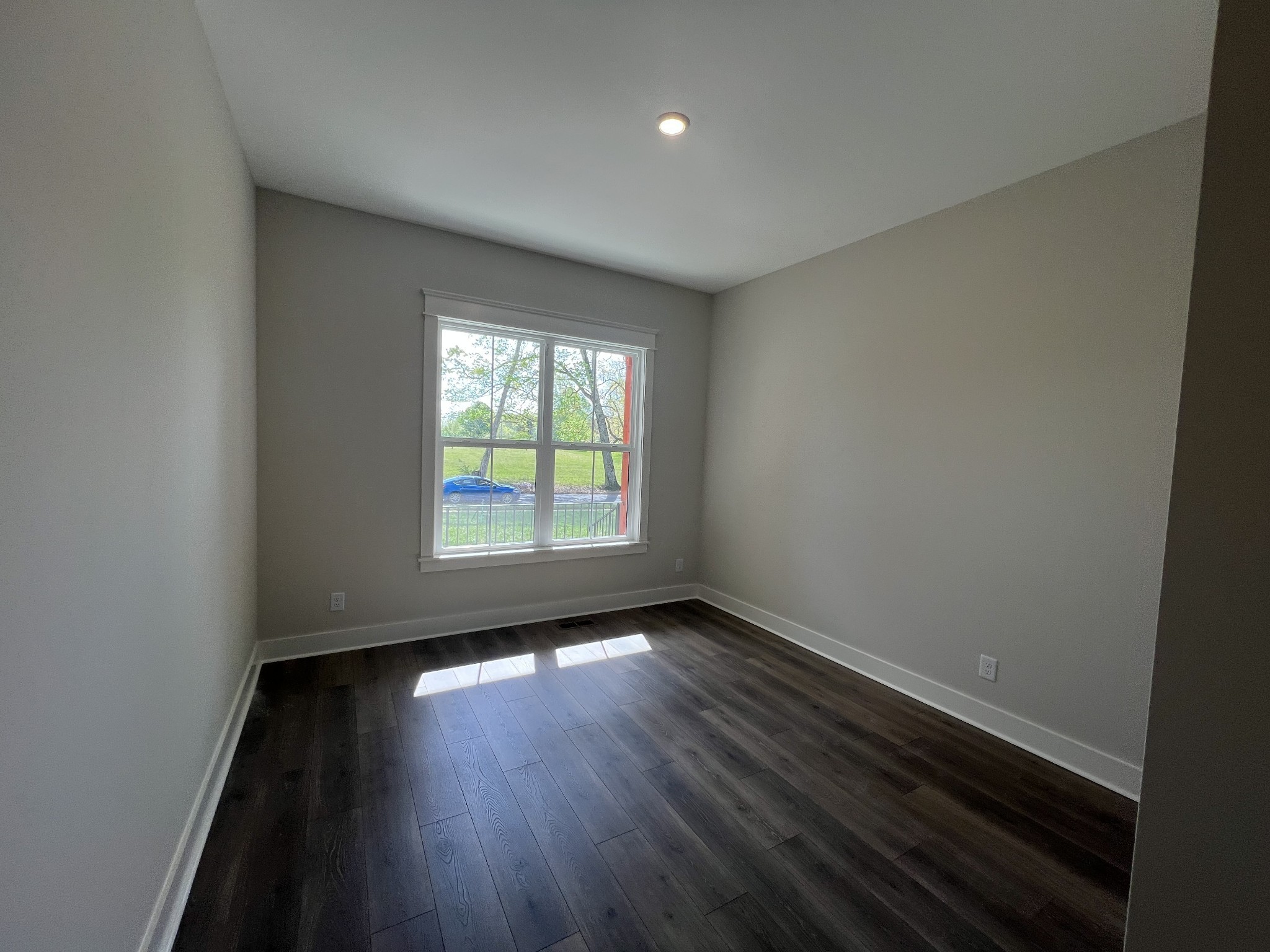 7285 Northwest Highway Fairview, TN 37062 - Photo 17 of 22 an empty room with wooden floor and windows