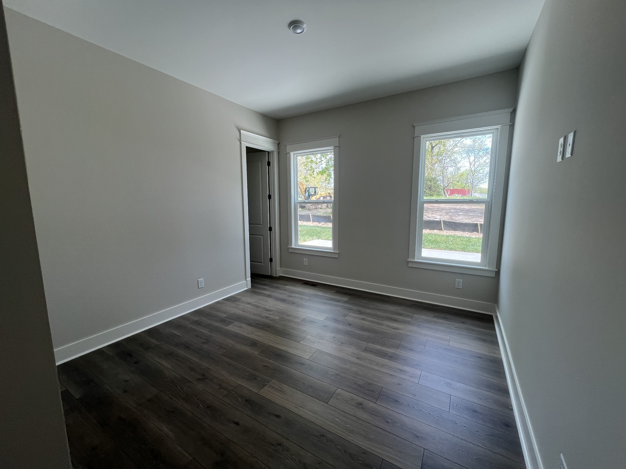 7285 Northwest Highway Fairview, TN 37062 - Photo 18 of 22 an empty room with wooden floor and windows