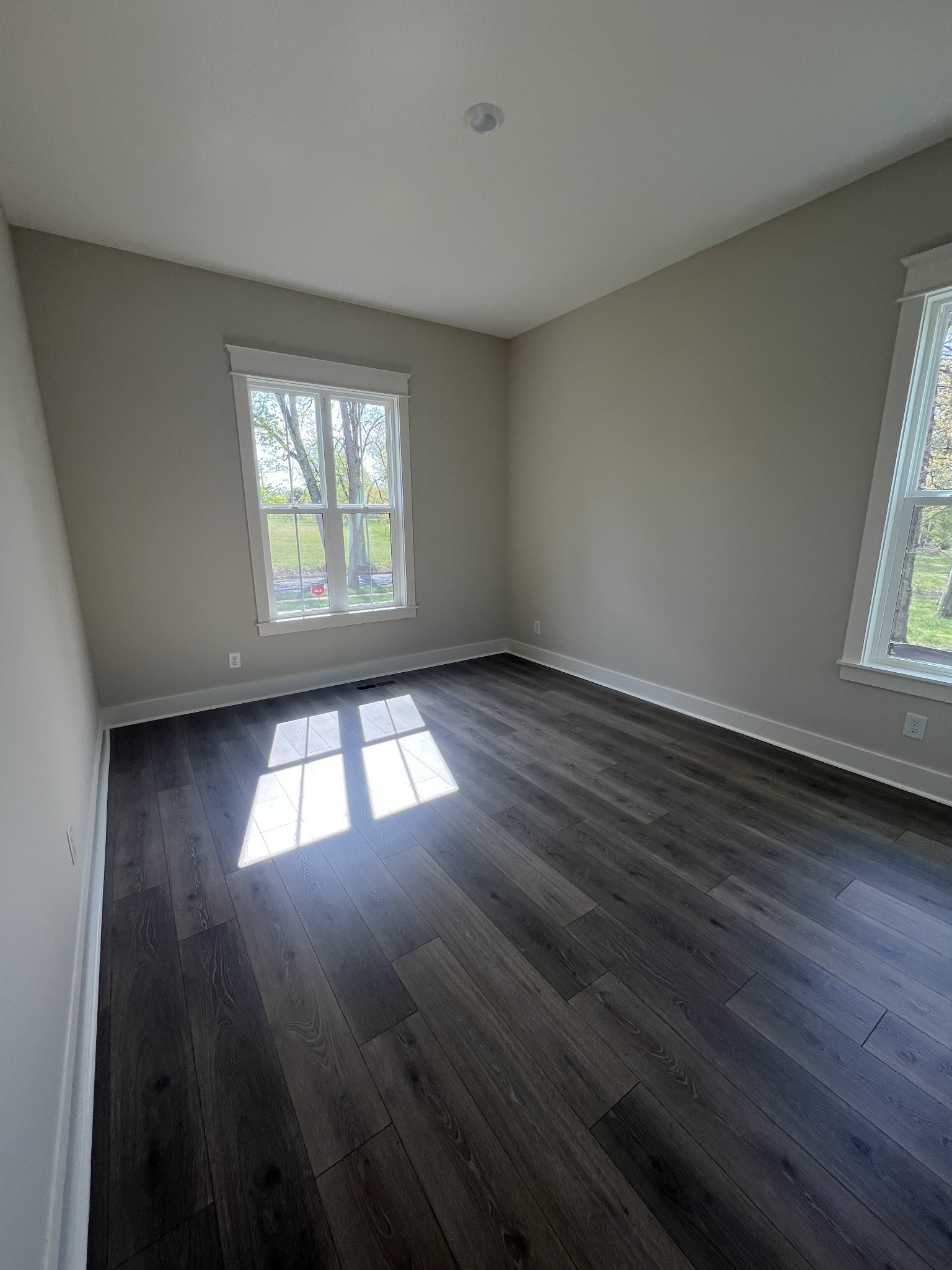 7285 Northwest Highway Fairview, TN 37062 - Photo 21 of 22 an empty room with wooden floor and windows