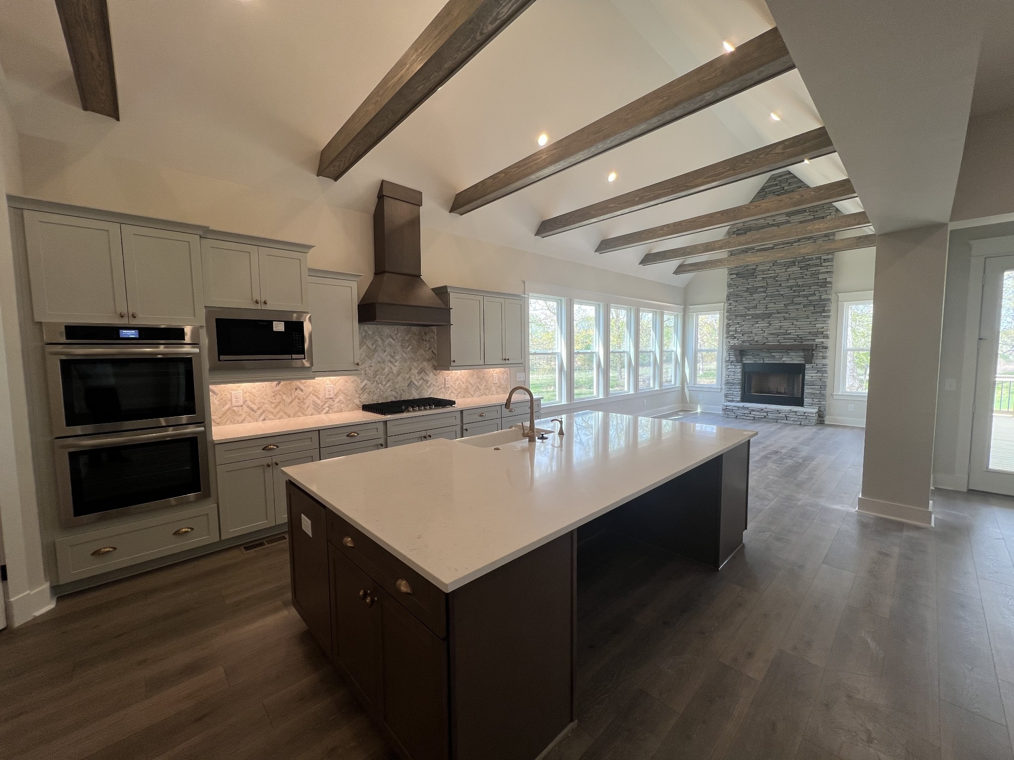 7285 Northwest Highway Fairview, TN 37062 - Photo 9 of 22 a kitchen with sink cabinets and wooden floor