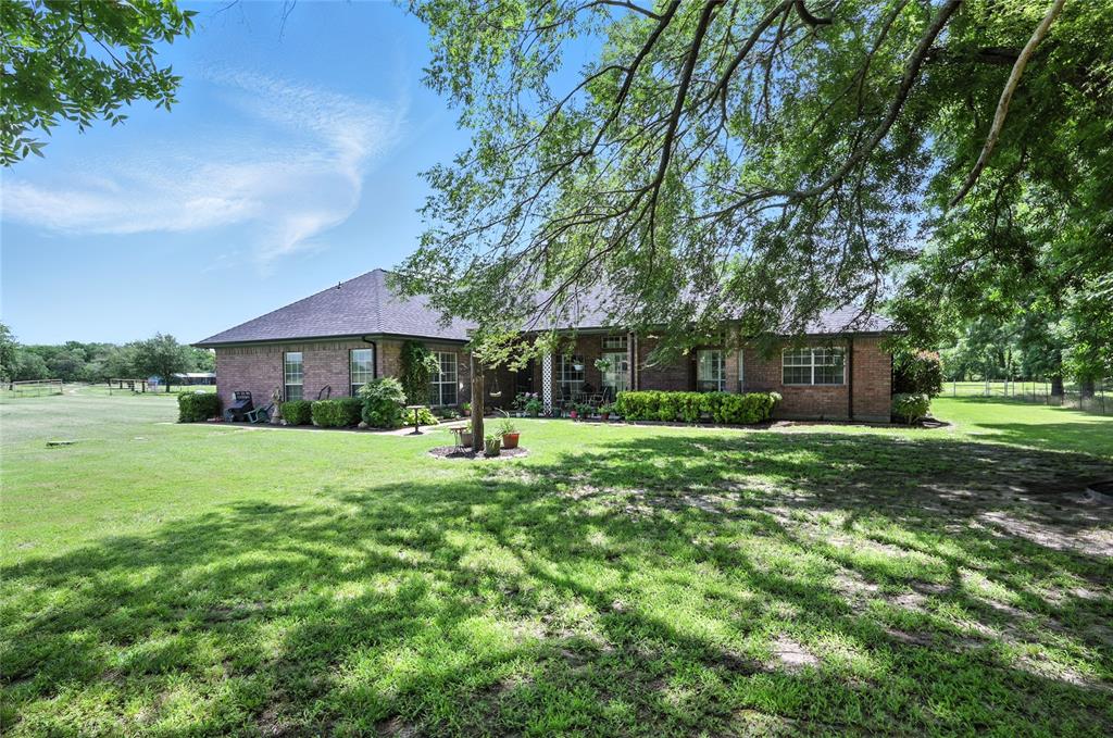 2134 Rains County Road 1402 Point, TX 75472 - Photo 2 of 26 a front view of a house with a yard