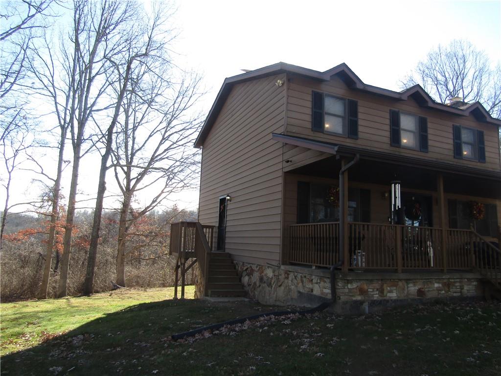 204 Castile Ridge Road Marianna, PA 15345 - Photo 17 of 17 a front view of a house with a yard