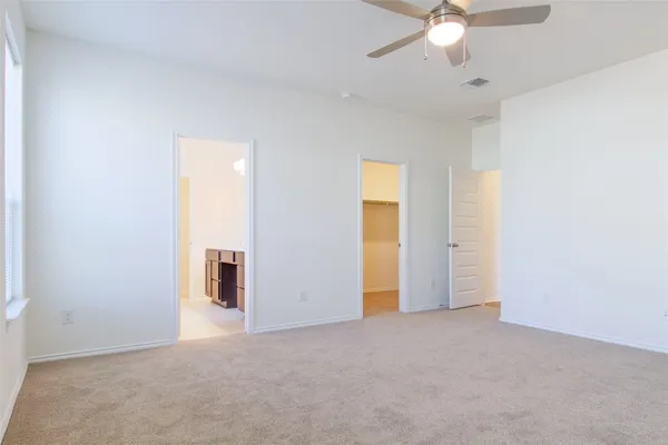 a kitchen with stainless steel appliances a refrigerator and cabinets