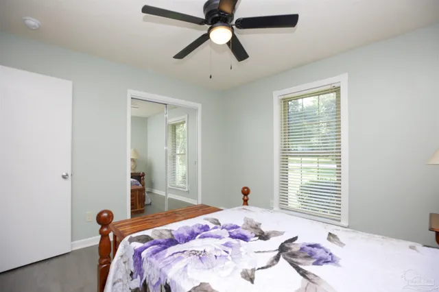 a bathroom with a sink a toilet and a shower curtain