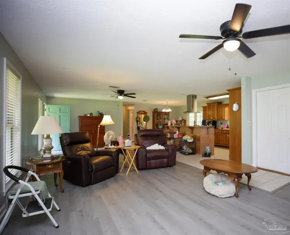 a kitchen with stainless steel appliances kitchen island granite countertop a sink and cabinets