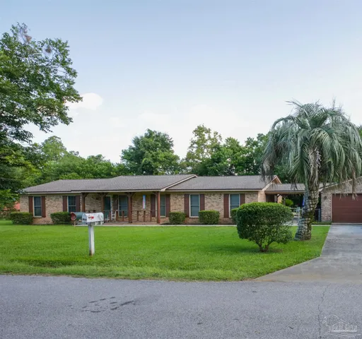 a view of a porch with chairs and a potted plant