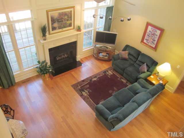 95 Oak Grove Church Road Youngsville, NC 27596 - Photo 13 of 25 View of the two story living room featuring 19' ceilings and gas log fireplace with gas logs! Enjoy reading your favorite book while relaxing in front of the fire!