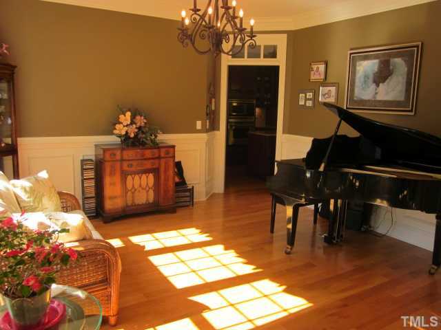 95 Oak Grove Church Road Youngsville, NC 27596 - Photo 14 of 25 This room could be your dining room or also works great for the piano! You choose what you need to use it for! Dining room features hardwood floors and wainscoting!