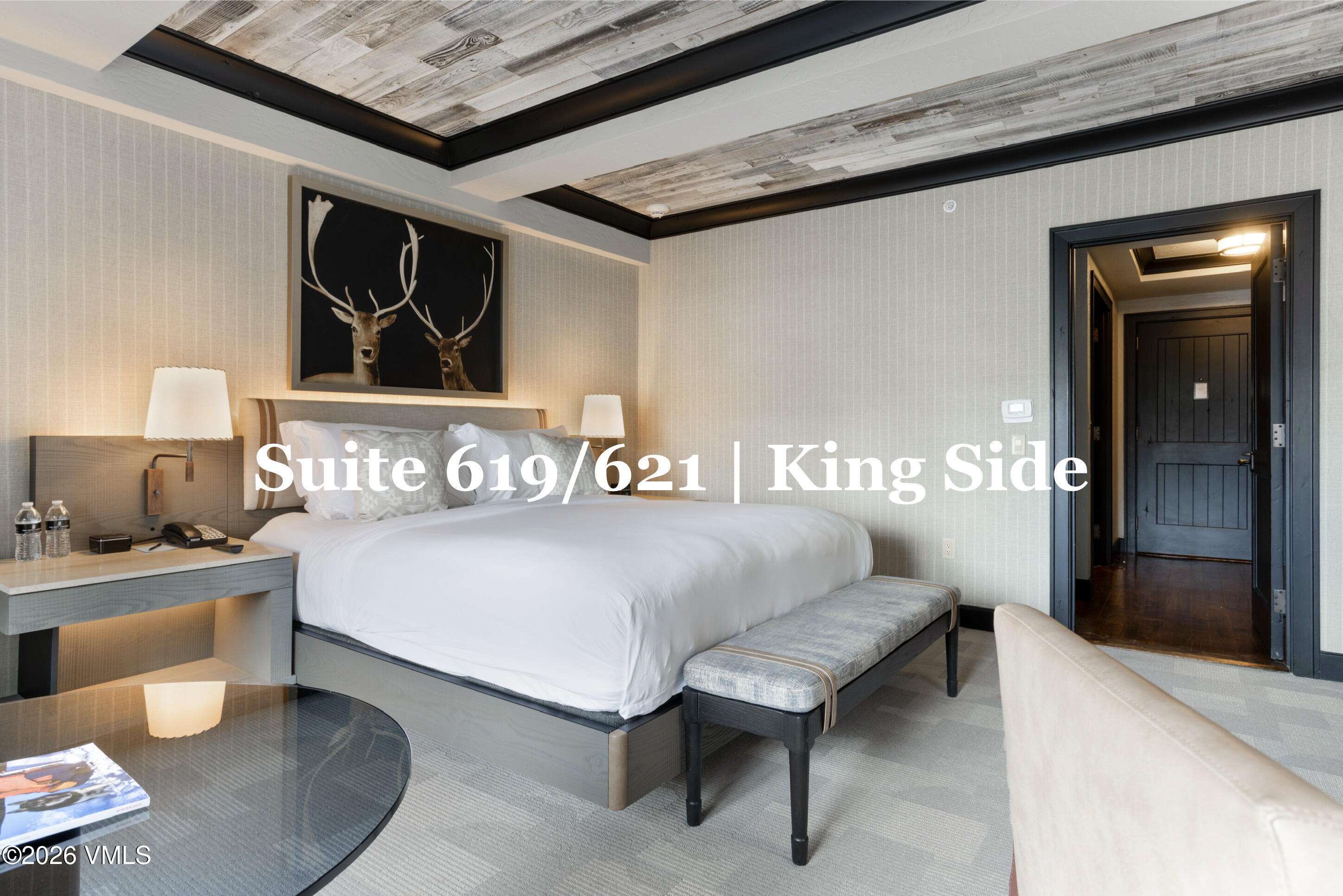 130 Daybreak Ridge Road, Unit HS619 Avon, CO 81620 - Photo 32 of 75 a bedroom with a bed and a lamp on dresser