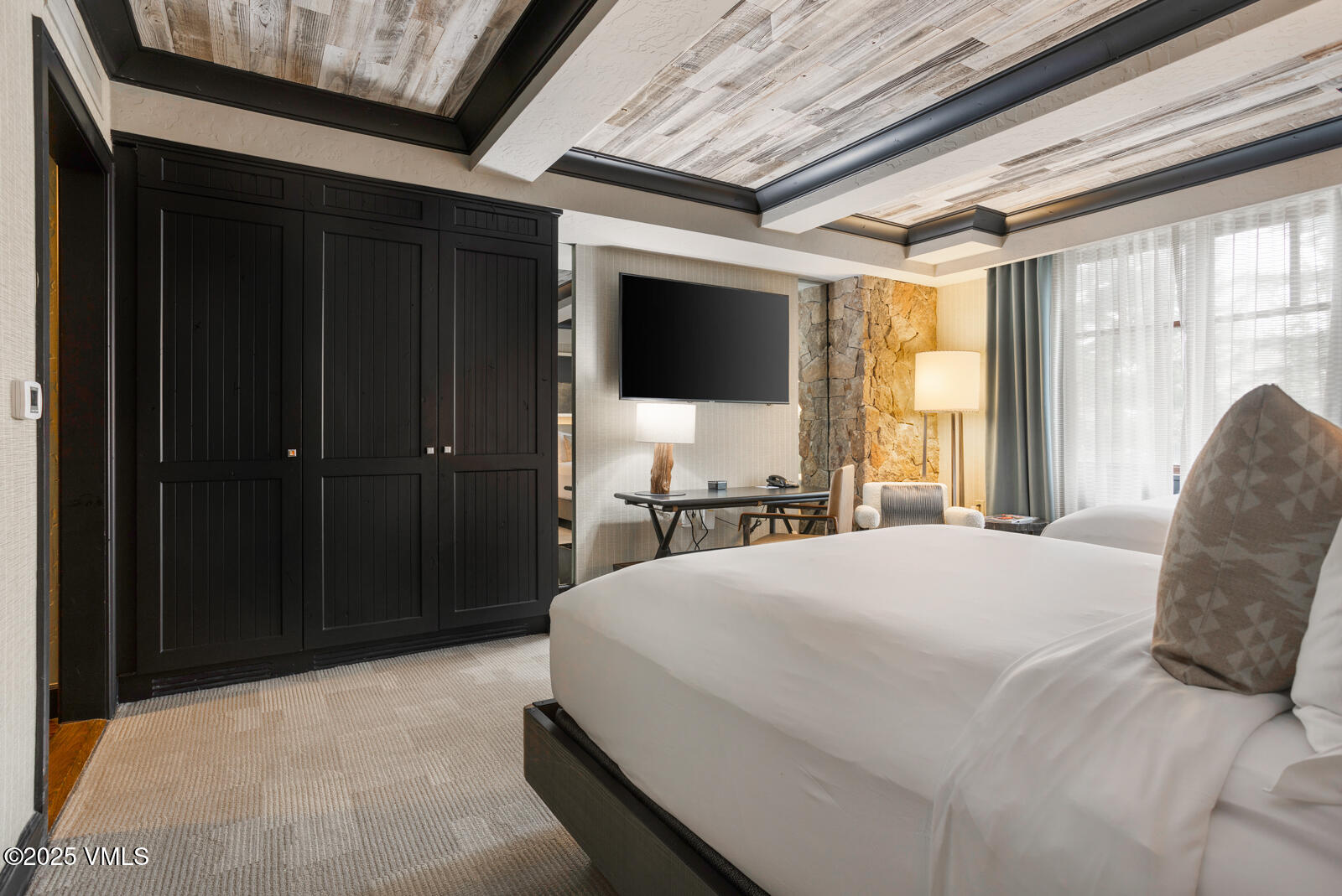 130 Daybreak Ridge Road, Unit HS619 Avon, CO 81620 - Photo 49 of 75 a bedroom with a bed and a window